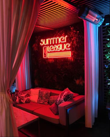Summer League neon lounge cabana activation.webp