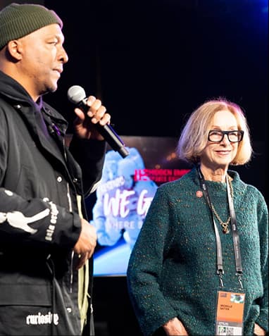 Deon Taylor with Michelle Satter on the We Got Next stage.webp